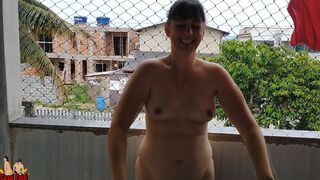 Wife works nude on balcony teasing her cuckold husband