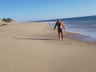 Beach walking in tiny bikini