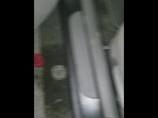 Cumming in public in a parking lot outside