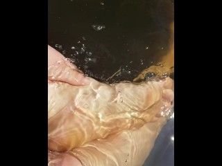 Cute red manicured wet feets