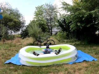 Cyclist pup in pool - cooling down and pawing off