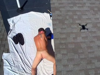 Drone caught naked male outdoors on roof jerking off nudist painting public
