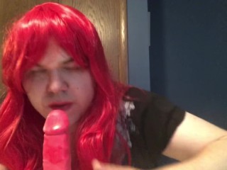 Guy crossdresses like a sissy and sucks cum off dildo