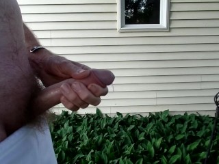 Jerking my dick in the backyard......