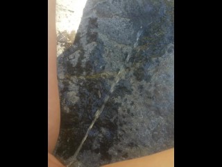 Long Pee Outside On Rock