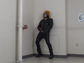 masked leather man quickly shoots his load in hotel stairway