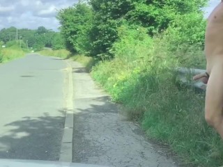 Naked with a semi in the road