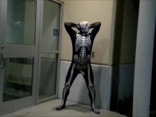 nighttime skeleton jerking off in front of outside doors