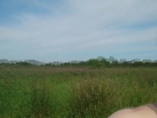 Nude walk through the grass