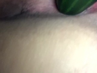 Playing with a huge cucumber