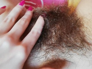 Playing with my thick hairy bush big clit pussy close up