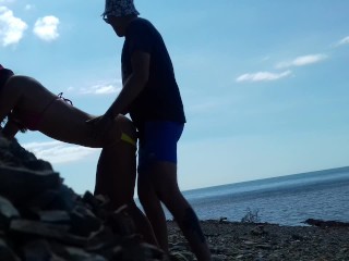 Real amateur doggystyle on the public beach. Outdoors sex.
