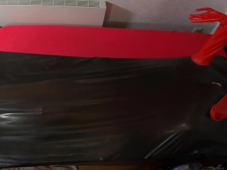 Rubberdoll get in Vacbed with gloves