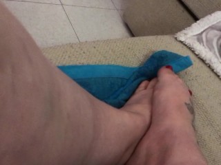 rubbing my feet playing with my pussy with a vibrator... feels good!