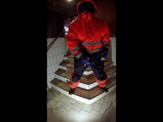 Rufus pawing off in Raingear