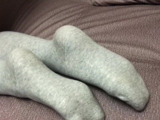 Sexy girl show feet in pantyhose and gray knee socks stockings