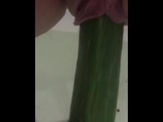 Shaved pussy taking long cucumber