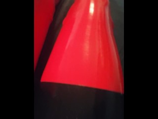 Shiny red latex rubber stockings closeup