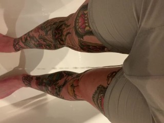 Tattooed guy wetting boxers