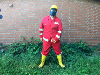 Worker Pup pawing off in red and yellow workgear